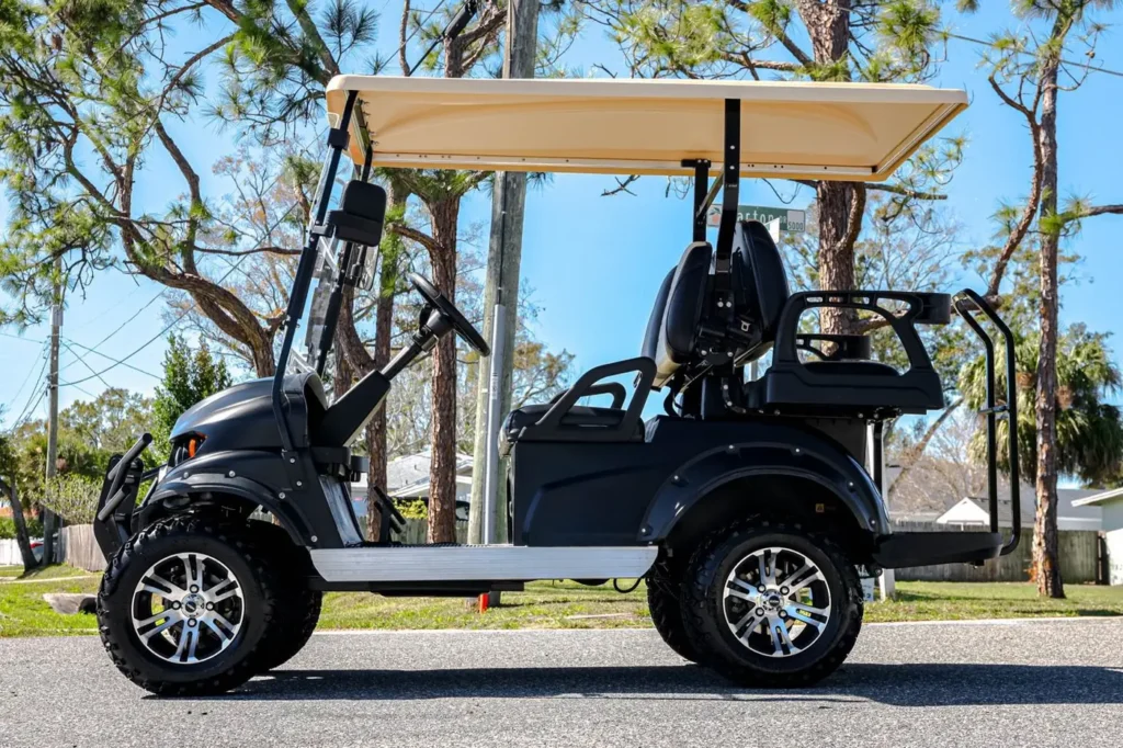 Black wrapped four-seat golf cart, side profile