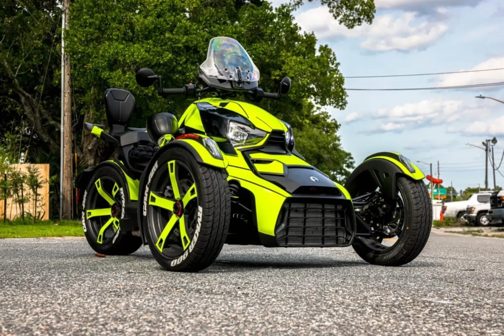 Can-Am three-wheel motorcycle with a neon yellow and black wrap