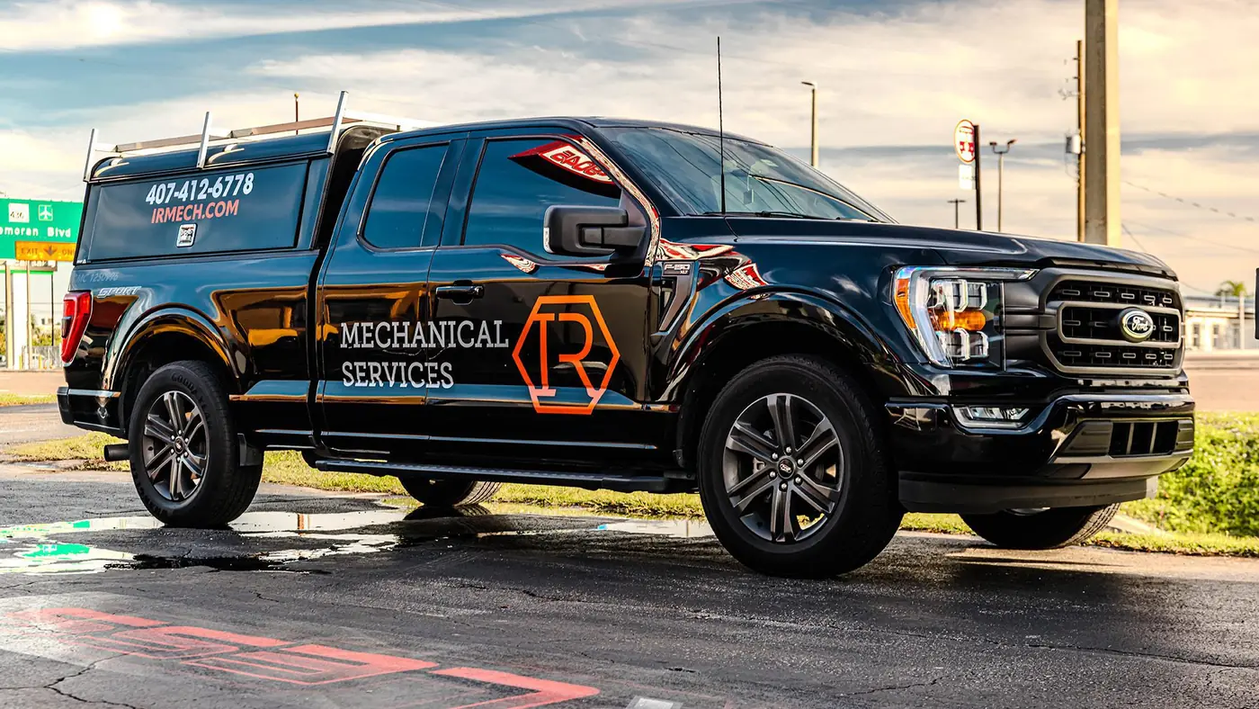 Black Ford F-150 with commercial lettering for a mechanical services company