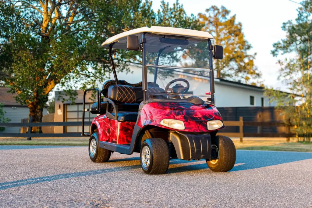 Golf cart with a red and black abstract wrap, Orlando FL