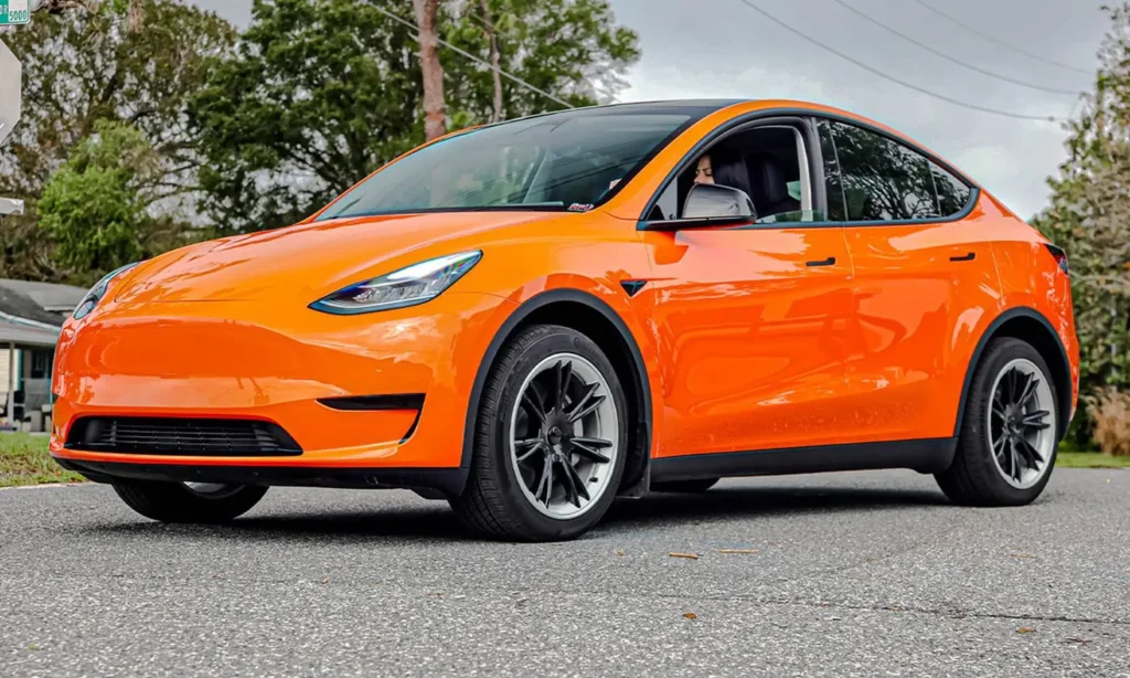 Orange Tesla Model Y with paint protection film