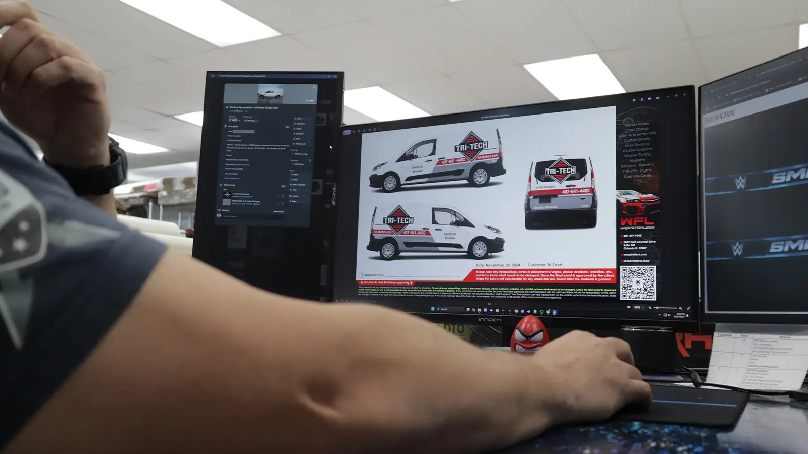 Designer preparing a van wrap design proof on a computer