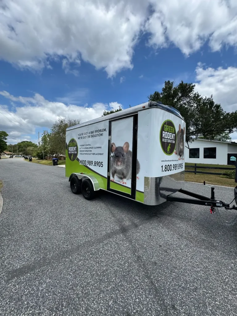 White enclosed cargo trailer with business wrap graphics