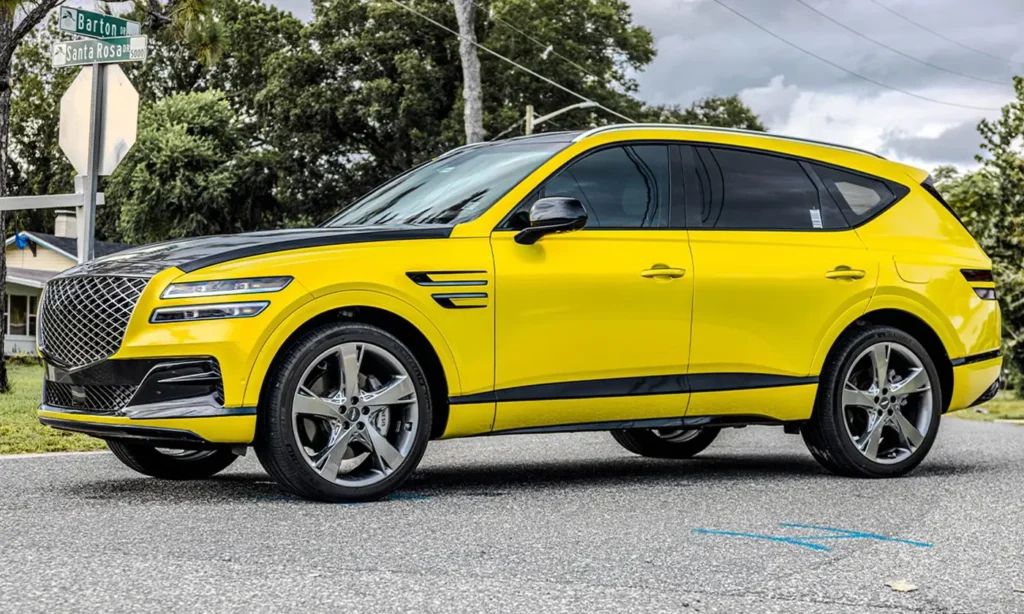 Genesis SUV with a yellow color change wrap